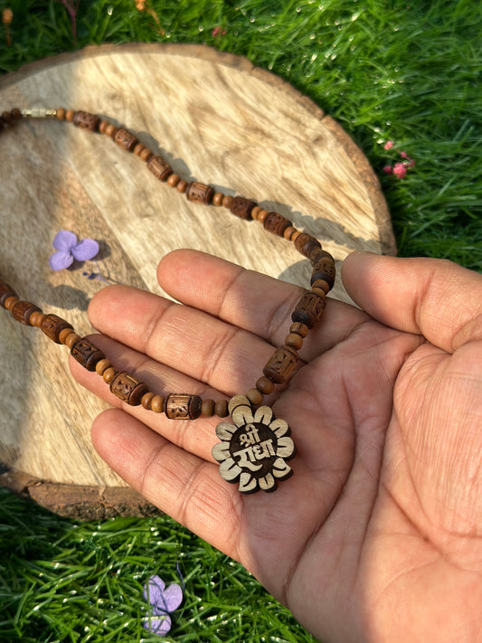Shri radha flower shape locket with brown radha engraved tulsi mala 18 inch (ghee dipped)