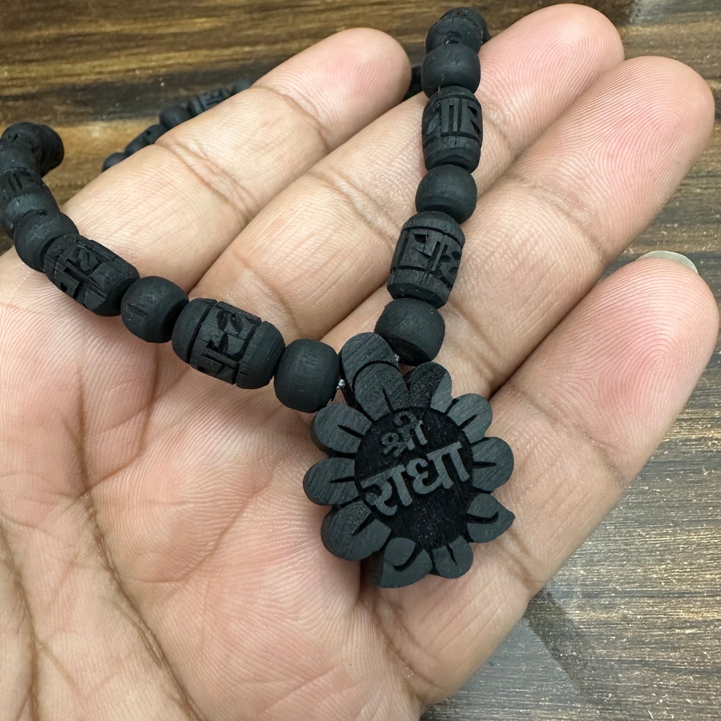 1 round Black tulsi mala with radha flower locket (radha engraved bead)