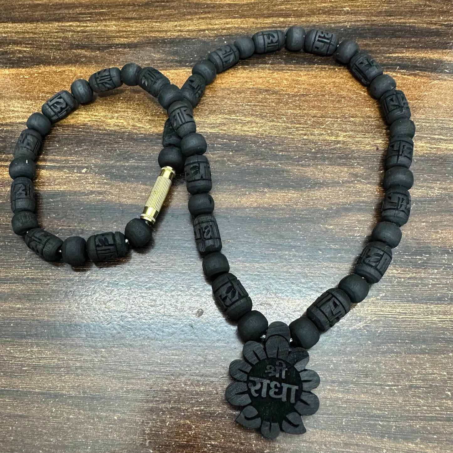 1 round Black tulsi mala with radha flower locket (radha engraved bead)