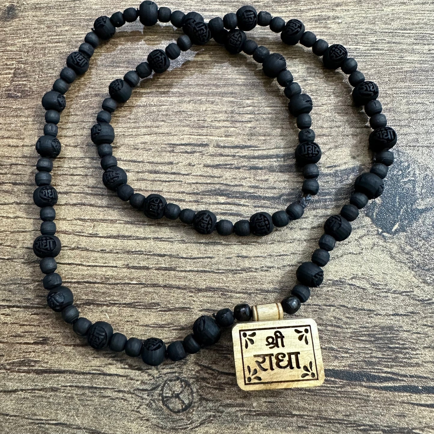 Shri radha bhaktmaal tulsi mala with black radha engraved pure tulsi beads 24 inch
