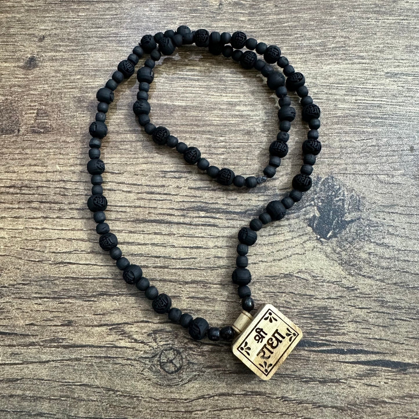 Shri radha bhaktmaal tulsi mala with black radha engraved pure tulsi beads 24 inch